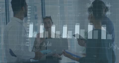 Business Team Analyzing Financial Data Projection in Office