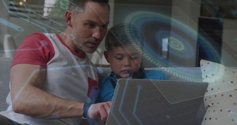Father guiding son on laptop with augmented reality overlays for digital learning