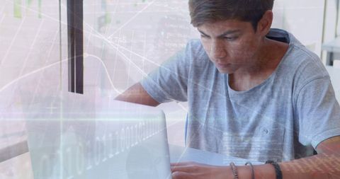 Teenager Studying with Laptop and Data Overlay - Download Free Stock Images Pikwizard.com