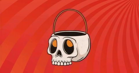 Floating Skull Candy Bucket on Vibrant Red Backdrop