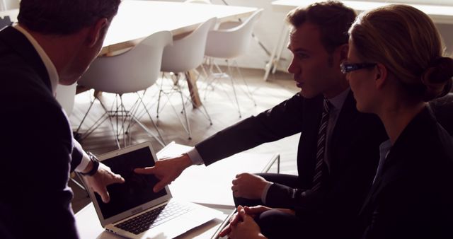 Business Team Discussing Strategy Over Laptop - Download Free Stock Images Pikwizard.com