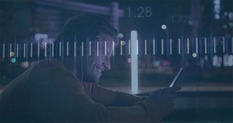Smiling man checking smartphone at waterfront during night with neon light bars overlay