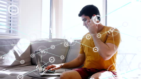 Man Discussing Connected Technologies on Phone and Computer