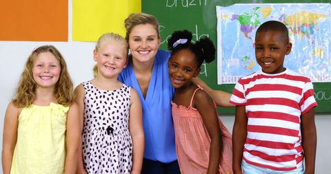 Group Portrait of Happy Teacher and Children in Classroom - Download Free Stock Images Pikwizard.com