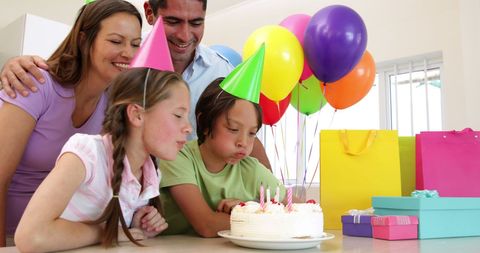 Family Celebrating Birthday With Cake in Kitchen - Download Free Stock Images Pikwizard.com
