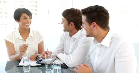 Cheerful Team of Colleagues Engaged in Productive Office Meeting - Download Free Stock Images Pikwizard.com