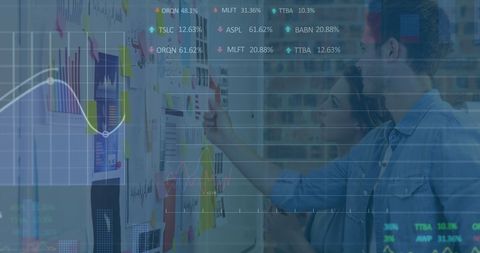 Business Analysts Exploring Data Insights in Modern Office
