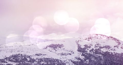 Dreamy Winter Mountain Scene with Snowy Forest and Light Effects