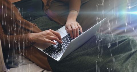 Woman Using Laptop with Holographic Data Interface