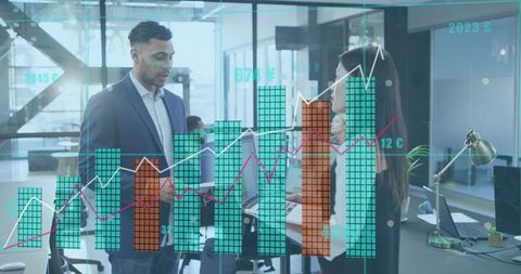 Business Professionals Analyzing Digital Financial Graphs in Modern Office