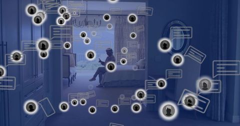 Senior woman sitting on bed holding smartphone with floating chat icons surrounding scene