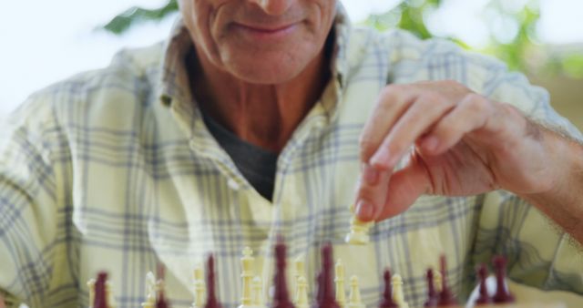 Senior Man Playing Chess Outdoors in Bright Sunshine - Download Free Stock Images Pikwizard.com