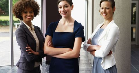 Confident Businesswoman Team Standing Together in Office Environment
