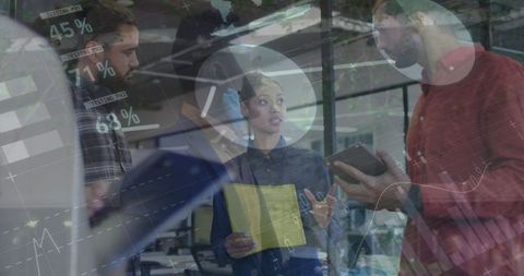 Colleagues analyzing data with digital overlay in warehouse