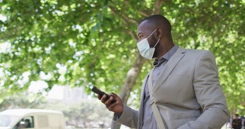Businessman with Mask Using Smartphone in Urban Setting - Download Free Stock Images Pikwizard.com