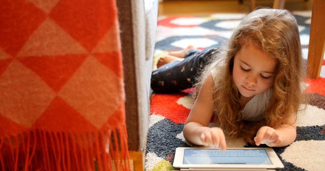 Little Girl Using Tablet on Floor at Home - Download Free Stock Images Pikwizard.com