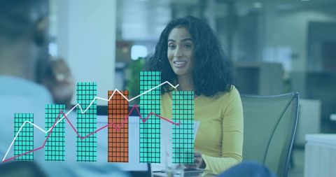 Businesswoman presenting data with colorful chart overlays in modern open-plan workspace