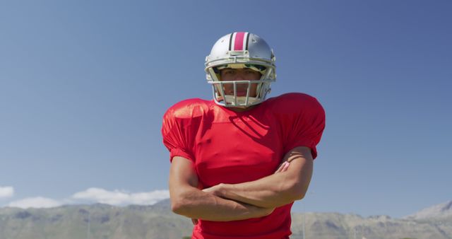 American Football Player Posing with Confidence on Sunny Day - Download Free Stock Images Pikwizard.com