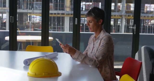 Female Architect Reviewing Construction Plans in Office - Download Free Stock Images Pikwizard.com