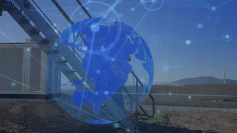 Engineer Observing Digital Globe and Wind Turbines Technology Concept