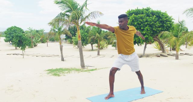 Young Man Doing Yoga on Tropical Beach - Download Free Stock Images Pikwizard.com