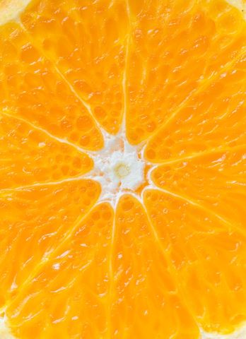 Close-up of Fresh Juicy Orange Slice Texture