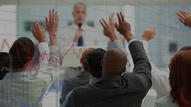 Business professionals of diverse backgrounds engaging in a financial presentation, shown raising hands actively participating. Ideal for illustrating themes of corporate training, team diversity, and business finance discussions. Effective for use in articles on education seminars at company events or showcasing interactive business presentations.