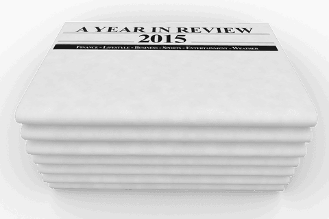 2015 year in review newspaper stack on transparent background