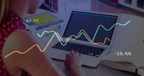 Young girl coding on laptop with data visualization in study environment