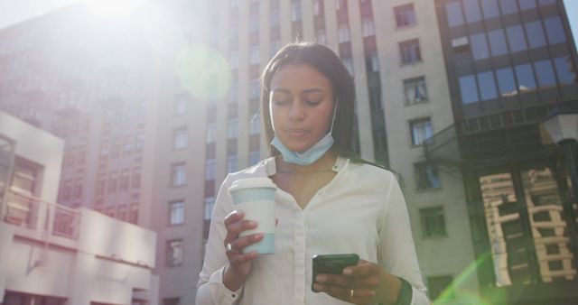 Young Professional Outdoors with Coffee and Smartphone in Urban Setting - Download Free Stock Images Pikwizard.com