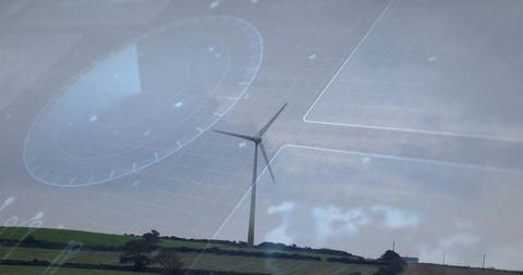 Wind turbine on green hill with futuristic digital overlay
