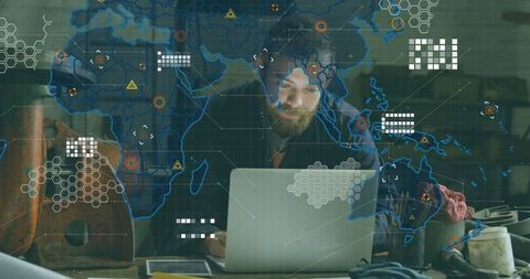 Man analyzing tech data at workshop counter with digital overlay