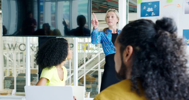 Professional Businesswoman Leading Group Presentation in Modern Office - Download Free Stock Images Pikwizard.com