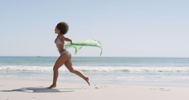 Happy Woman Running on Beach with Green Shawl - Download Free Stock Images Pikwizard.com