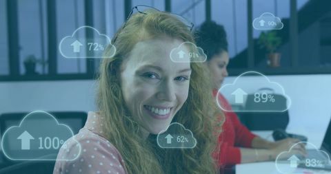Businesswoman smiling with overlay of digital cloud icons