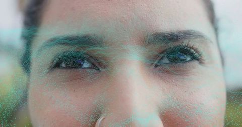 Futuristic facial recognition scan on woman in technology lab