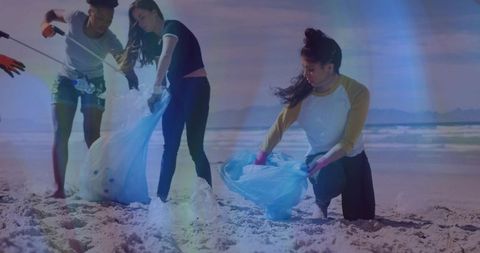 Environmentally Conscious Volunteers Recycling on Beach