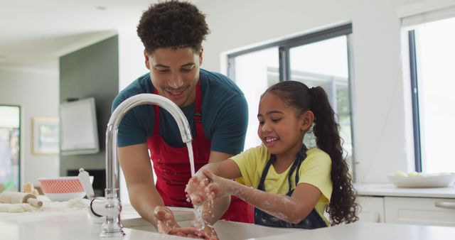 Father Teaching Daughter to Wash Hands in Modern Kitchen - Download Free Stock Images Pikwizard.com