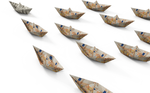Paper boats crafted from currency on transparent background