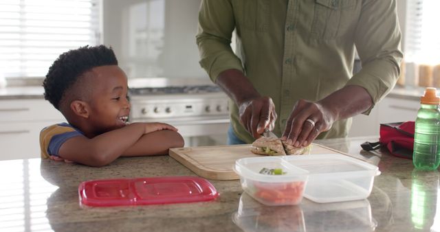 Father Making Sandwich for Excited Child in Kitchen - Download Free Stock Images Pikwizard.com