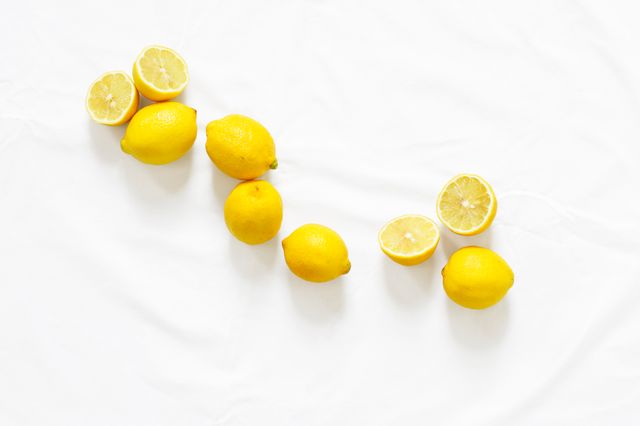 Fresh Lemons on White Background in Minimalist Style - Download Free Stock Photos Pikwizard.com