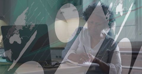 Senior Woman Analyzing Data and Writing Notes at Home