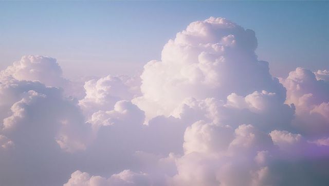 Heavenly Cumulus Clouds Against Pastel Sky with Soft Light