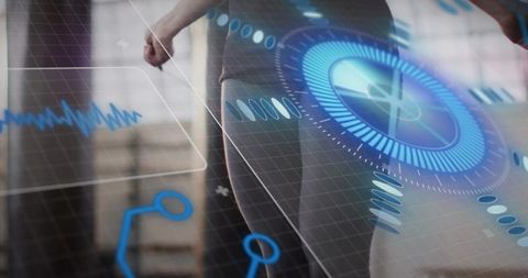 Mid-adult woman exercising in studio wearing dark leggings with biometric hud overlay