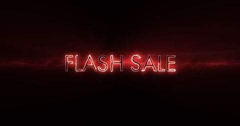 Neon flash sale sign in red on black background