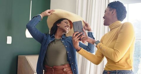 Joyful Friends Sharing Fun Moment Indoors