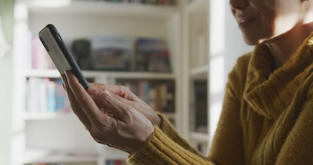 Woman Using Smartphone in Cozy Home Setting - Download Free Stock Images Pikwizard.com