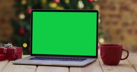 Laptop with Green Screen and Christmas Decorations - Download Free Stock Images Pikwizard.com