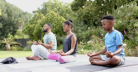 Family Yoga in Garden Focuses on Relaxation and Unity