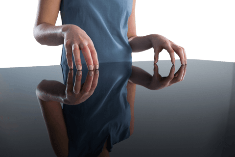 transparent businesswoman's hands reflecting on glass table - Download Free Stock Videos Pikwizard.com